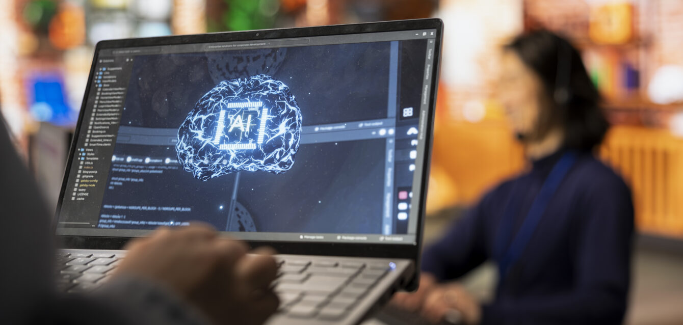 Call center worker uses AI technology on laptop to provide quick replies to common customer queries, close up. Customer service agent generates automated responses to clients using AI tech on notebook