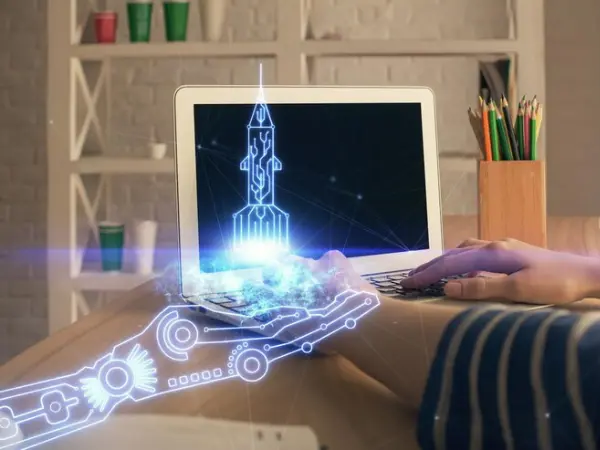 an working on laptop with icons for robotic process automation